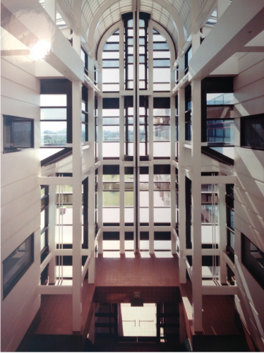 atrium of a big glass building with white interior