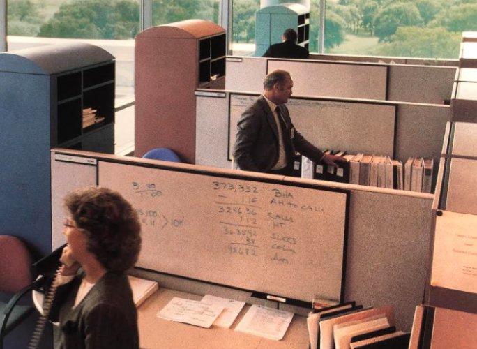 interior of two office workers in cubicles