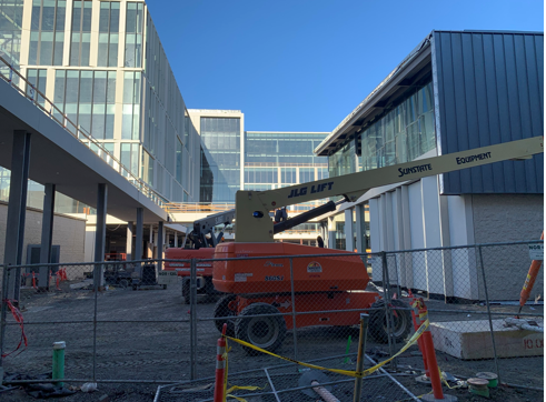 crane in a parking lot on a building site