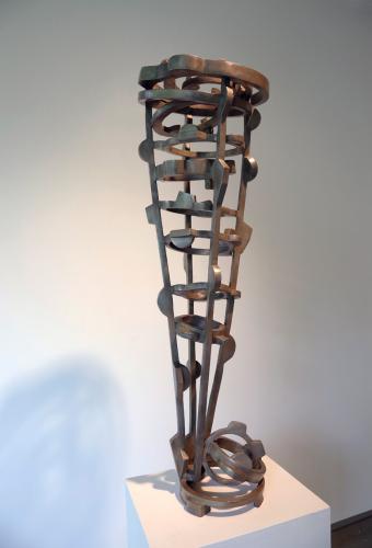 Tall funnel-shaped metal sculpture