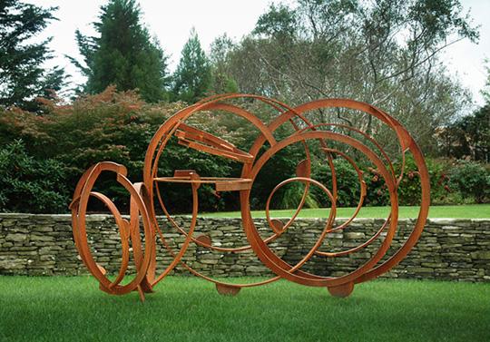 Seven Ponds: large brown steel sculpture with multiple circular sections