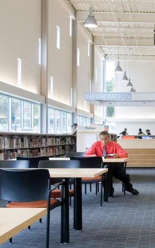 View of study area with long tables and chairs