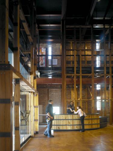 Entryway of a building with a brick and wood interior