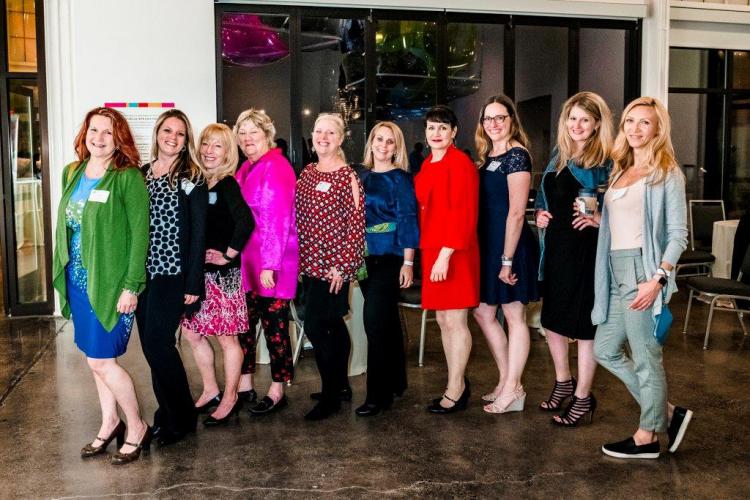 A group of women pose for a photo.