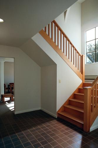 Interior stairway leads to the upper floor of the house.