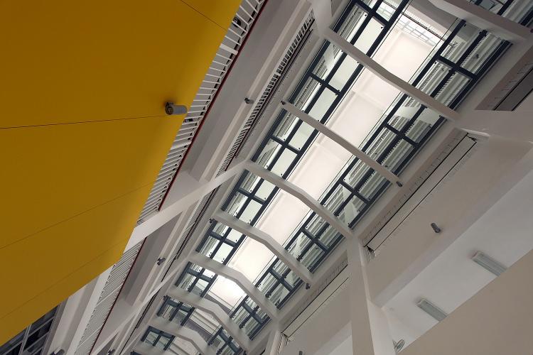 Upward view of a long atrium.