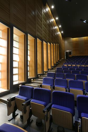 View of blue seats in an auditorium.