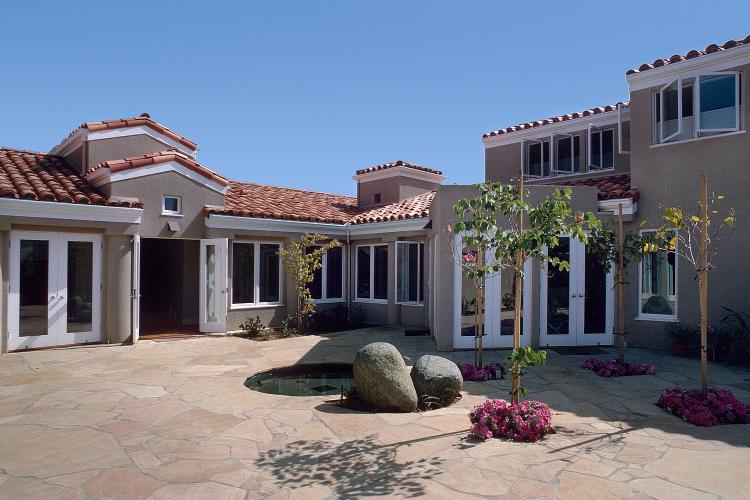 Exterior facade and courtyard of a private residence.