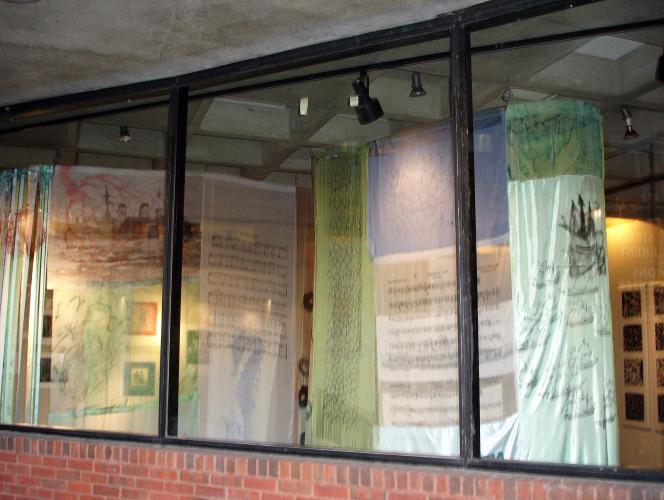 Image of installation art viewed through windows.