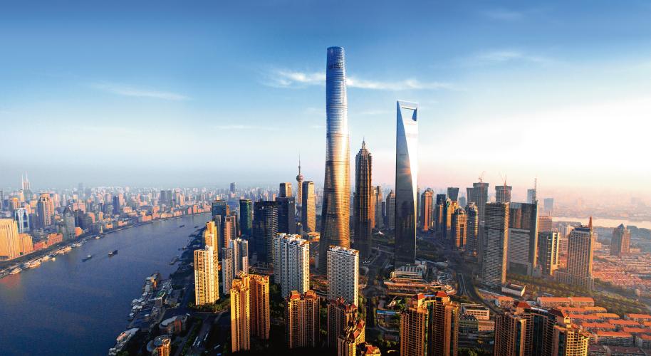 Aerial view of a skyscraper and surrounding buildings.