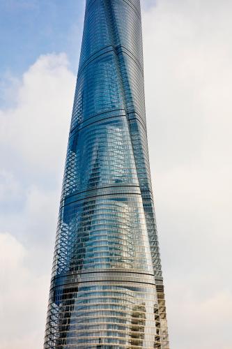 A transparent, spiraling tower stretches into the sky.