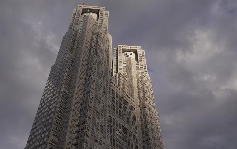 A skyscraper in front of a gray, stormy sky