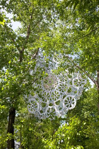 Closeup view of large white doily installed outdoors