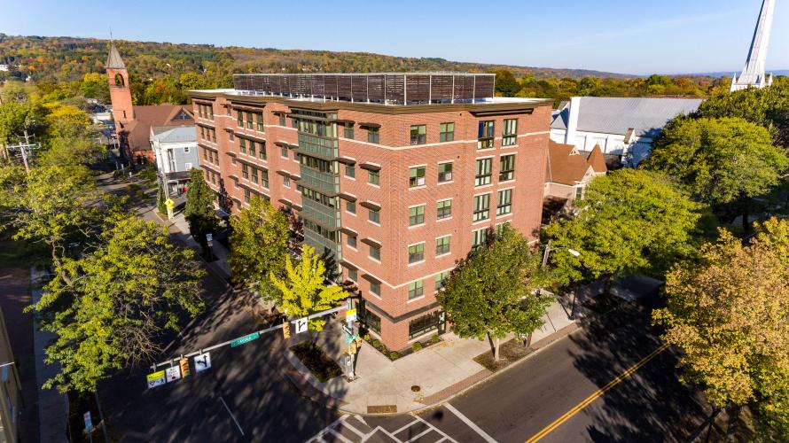 Aerial view of a multistory red brick building.