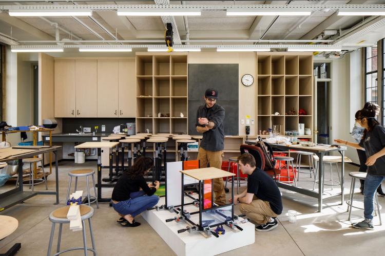 Students work on a project inside a classroom.