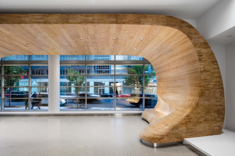 Close-up photo of architectural wood motif that borders the front of the lobby.