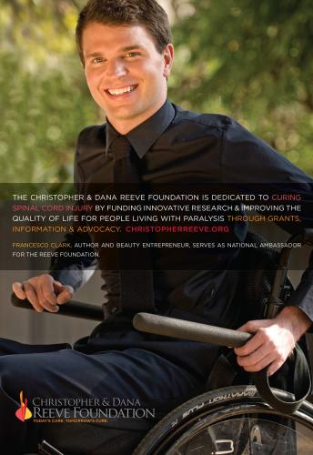 A man dressed in black, using a wheelchair, smiles at the camera in an ad for the Christopher & Dana Reeve Foundation.