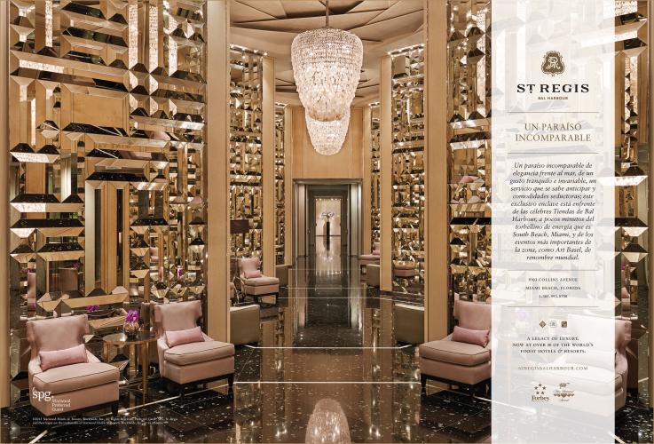 An advertisement for a luxury hotel, showing pink chairs in a ritzy hotel lobby with gold, reflective walls; a glossy floor; and a chandelier. 