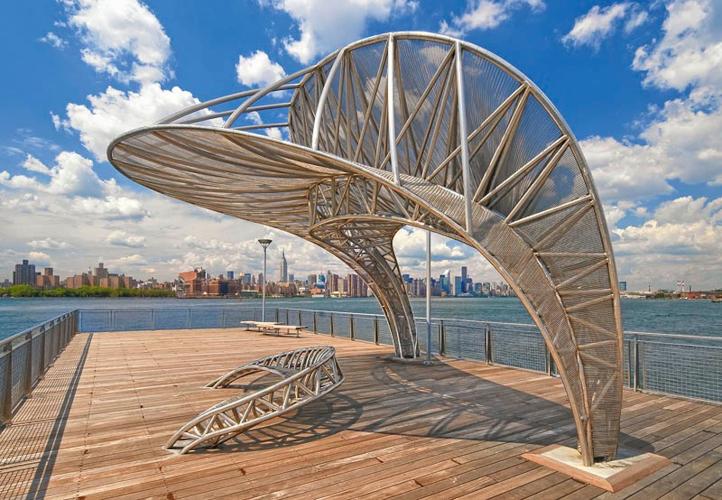 A stainless steel and mesh sculpture form shade and seating on the North 5th Street Pier in Brooklyn.