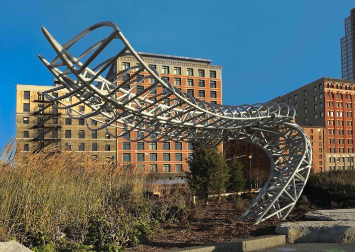 A largescale, outdoor serpentine-like structure sculpture.