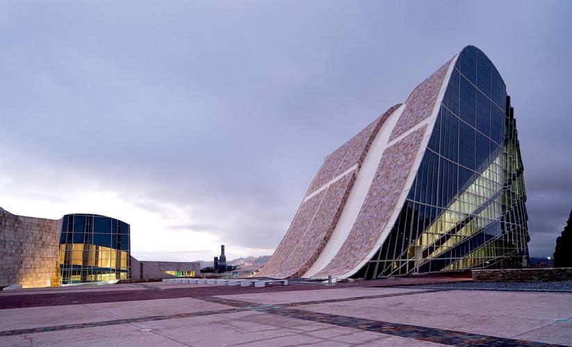 Exterior view of a building shaped like a parabola