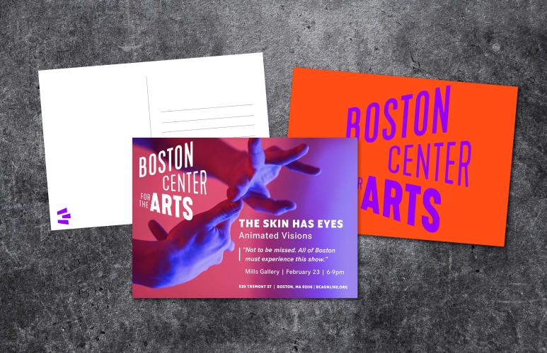 Three postcards for the Boston Center for the Arts are arranged on a dark gray tabletop
