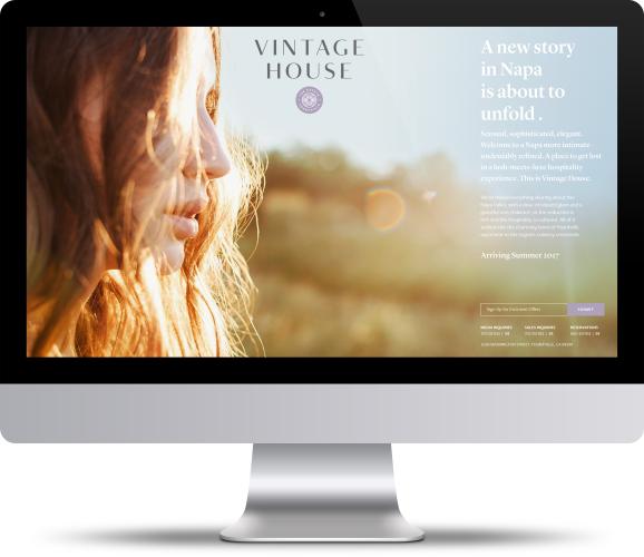 An iMac computer shows a webpage for Vintage House in Napa